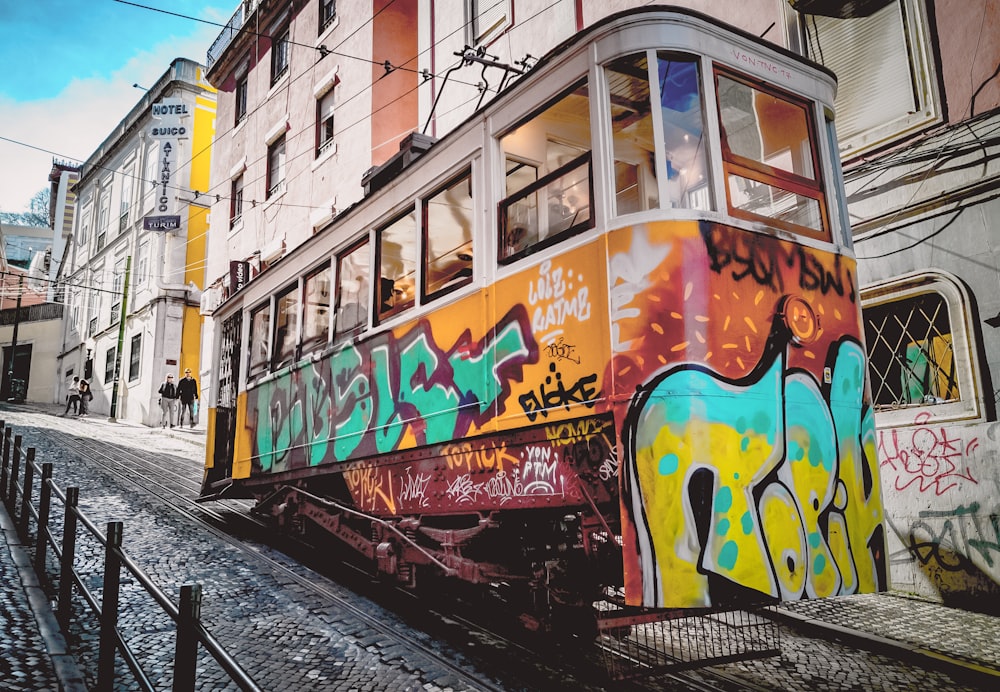 yellow and multicolored tram
