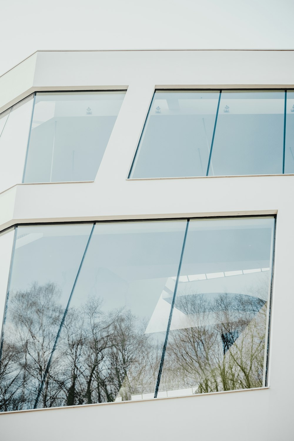 closed clear glass windows of white building