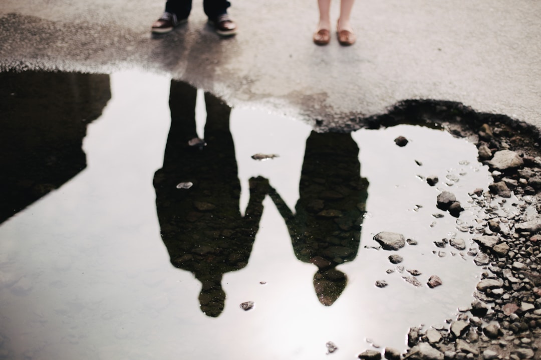 Reflection of a couple on a pre wedding shoot