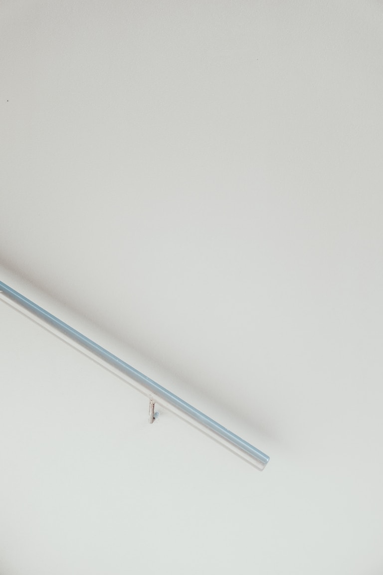 disability aid handrail with white metal frame