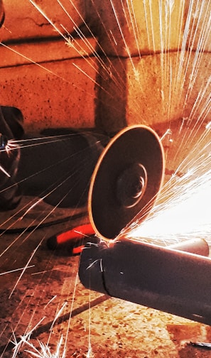 person grinding pipe steel wool photography