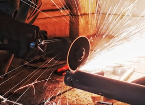 person grinding pipe steel wool photography
