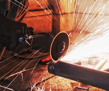 person grinding pipe steel wool photography