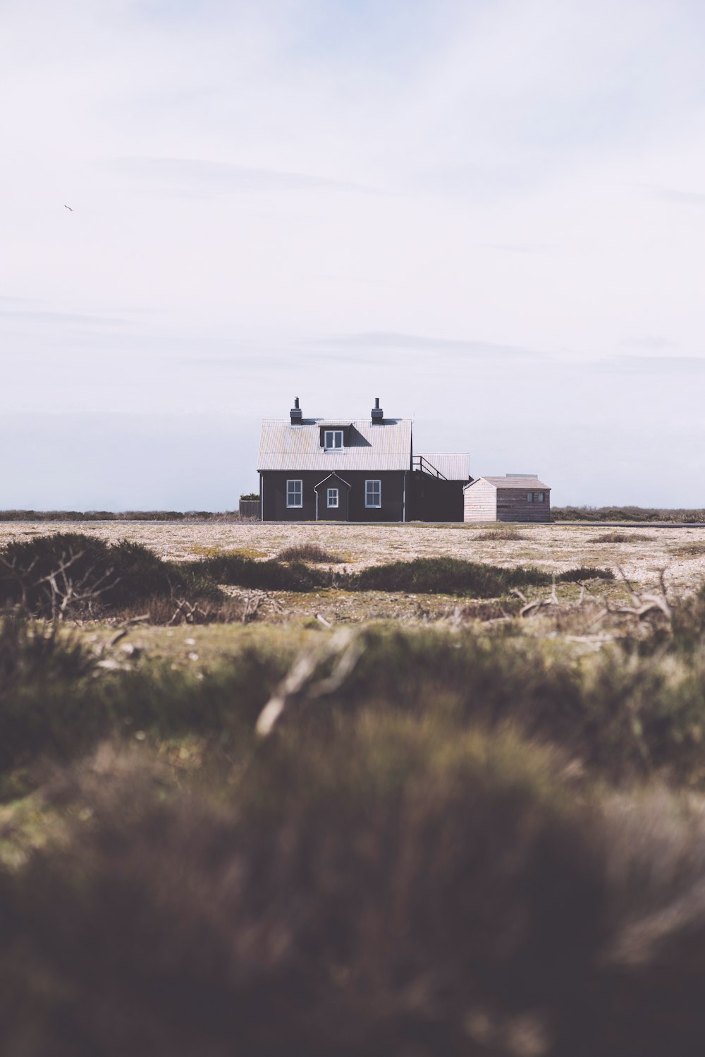 white and black house near green field