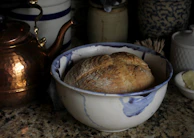 A cozy kitchen nook with Hearthstone ceramic bakeware warming in the oven.