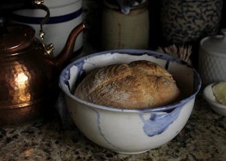 A cozy kitchen nook with Hearthstone ceramic bakeware warming in the oven.