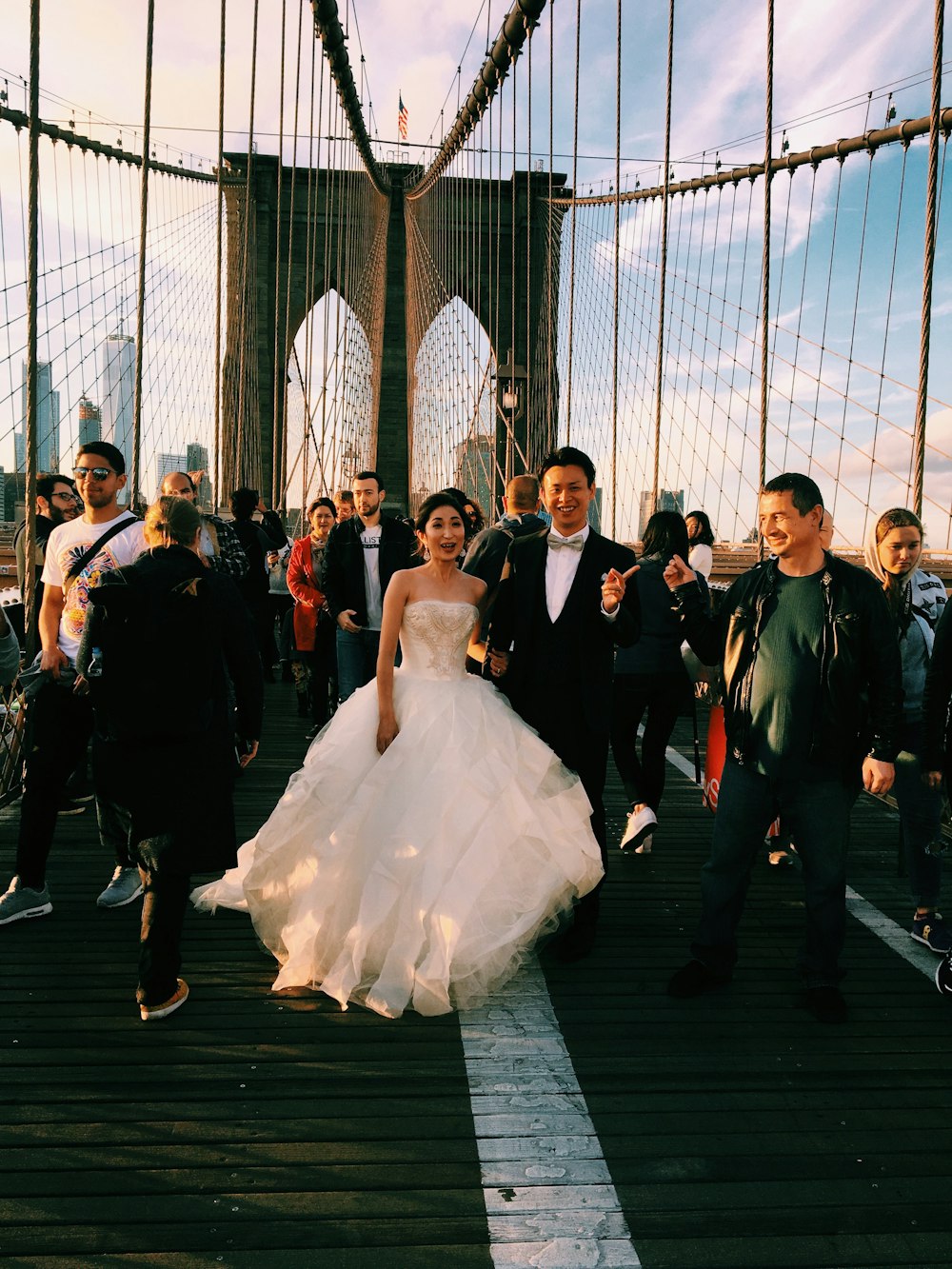 couple standing on suspension bridge