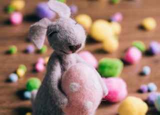 closeup photo of gray rabbit plush toy