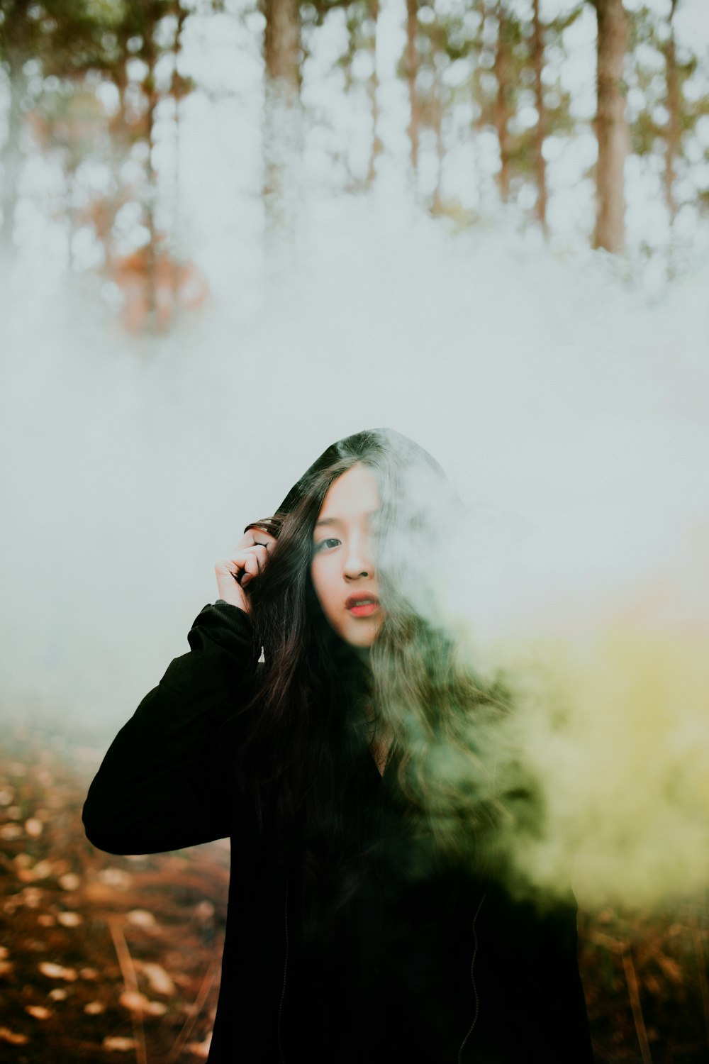 woman surrounded by smoke