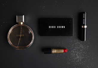 black makeup pallet with red lipstick