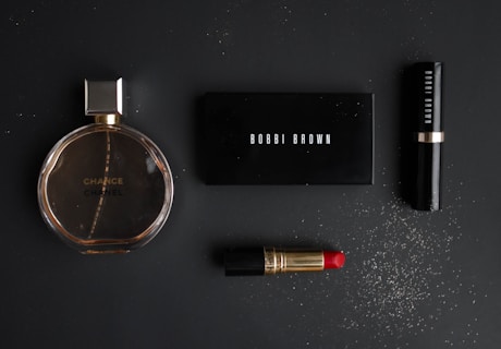 black makeup pallet with red lipstick