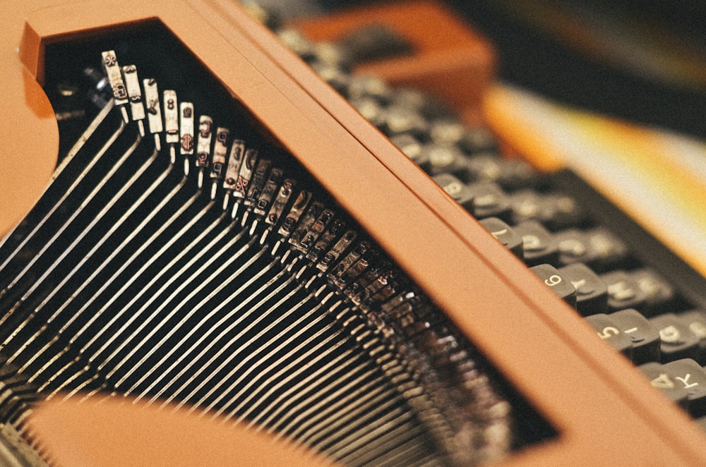 close-up photography of black and brown typewriter