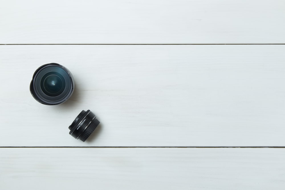 black camera lens on white board