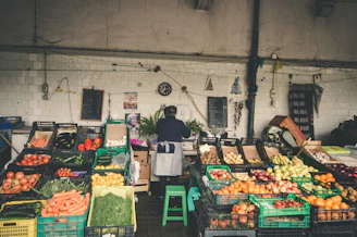 Farmers market stall with fresh produce and Pomodoro team planning content.