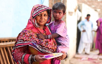 A mother and child enjoying a cultural celebration.