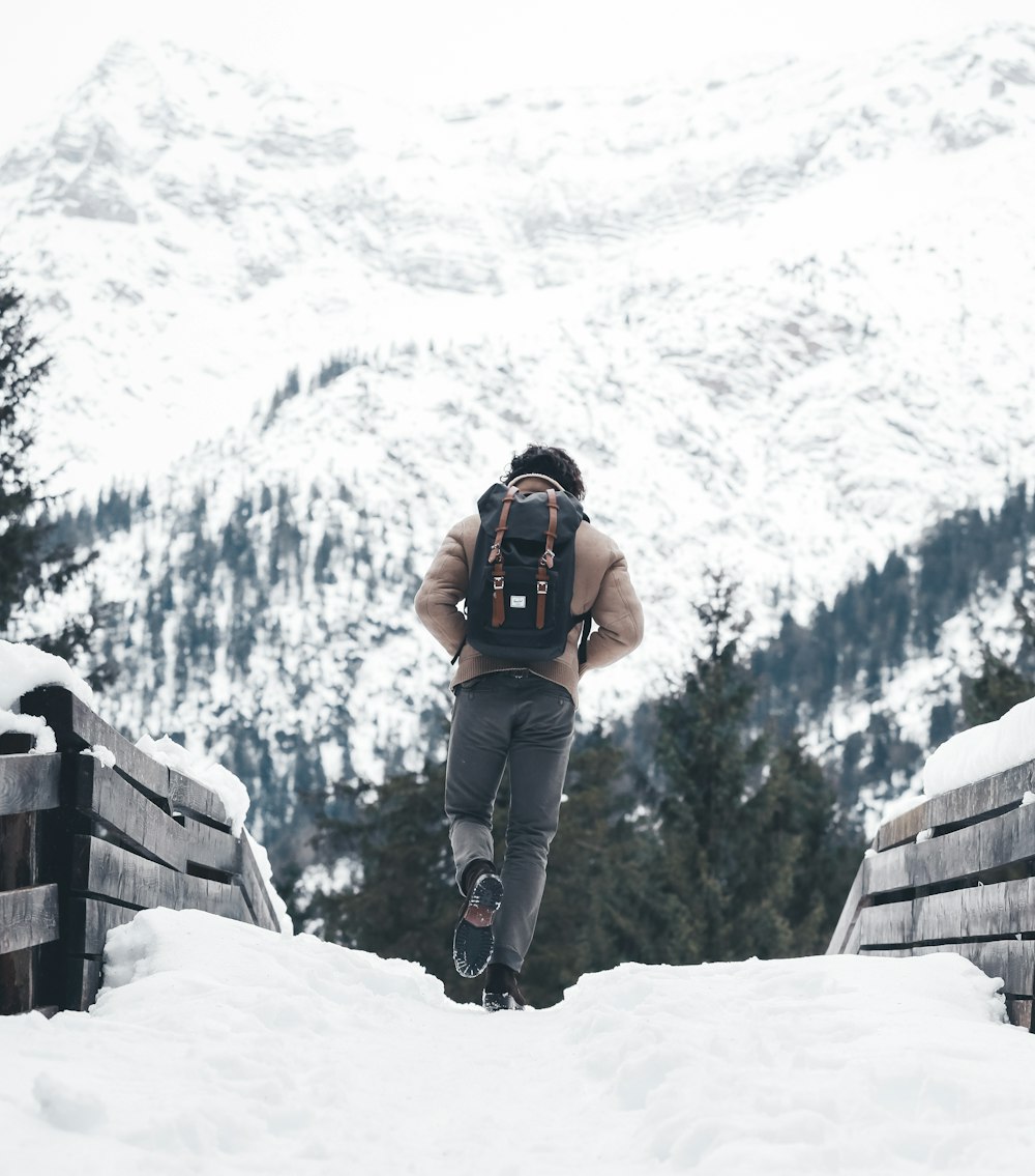 person walking on snowy road