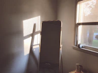 Sunlight streaming through a window onto a simple yet fresh face mask setup on the bathroom counter.