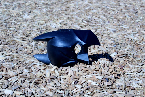 Limited edition sculptural object with matte black finish on pedestal.