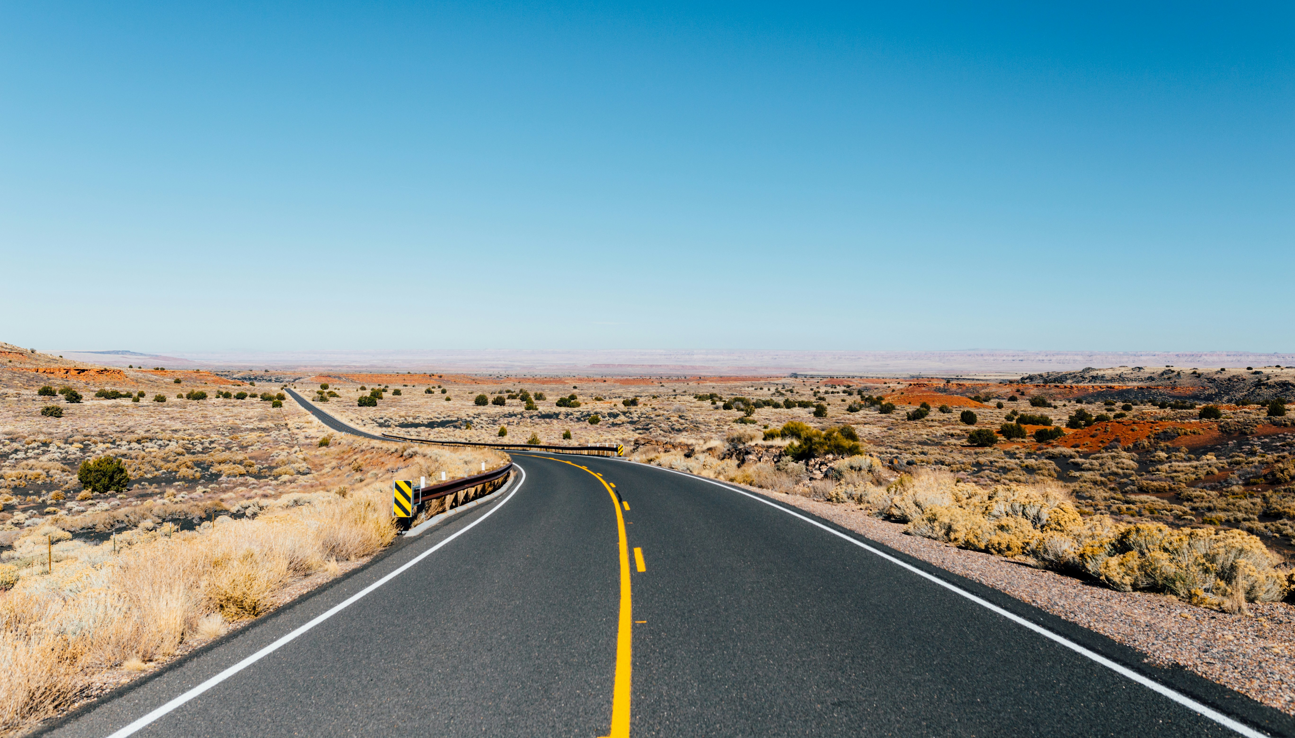 gray asphalt road near desert