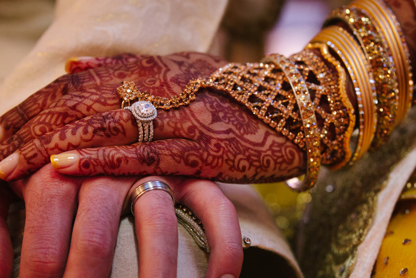 Detail of dark mehndi on a bride’s hand