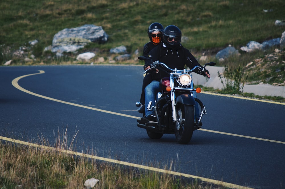 two persons riding motorcyle