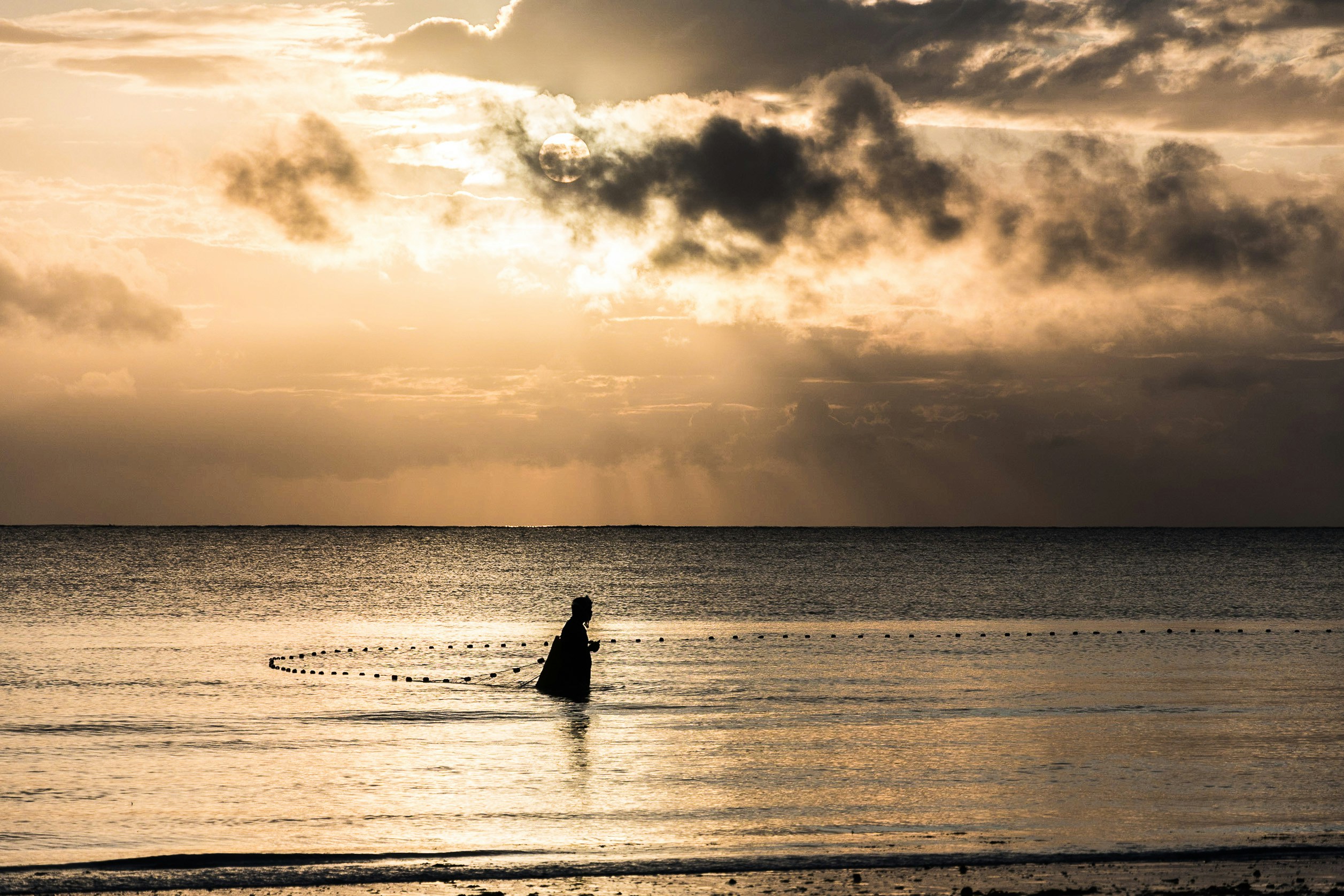 person on ocean during sunrise, 
