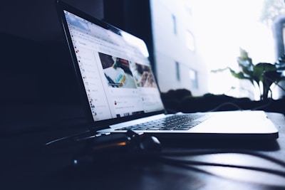 A calm environment with a laptop open to educational real estate content.