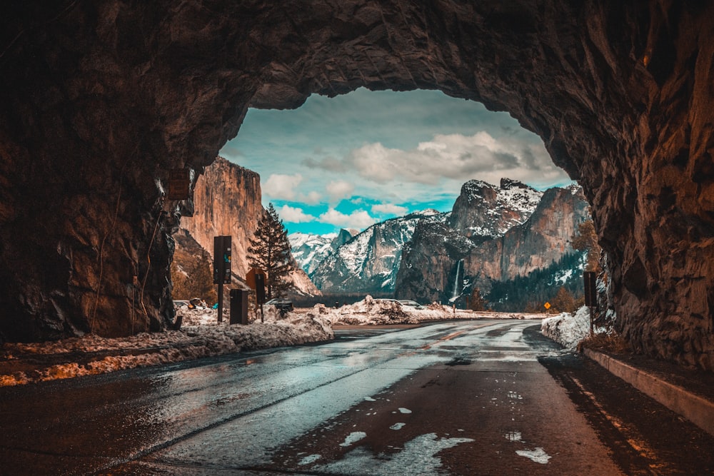 empty road tunnel leading to mountains