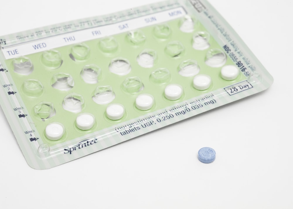 A green pack of contraceptive pills. 