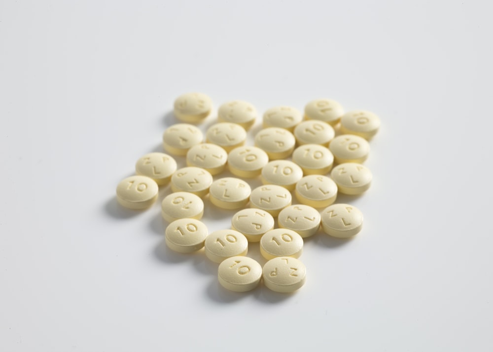 round yellow medication pill lot