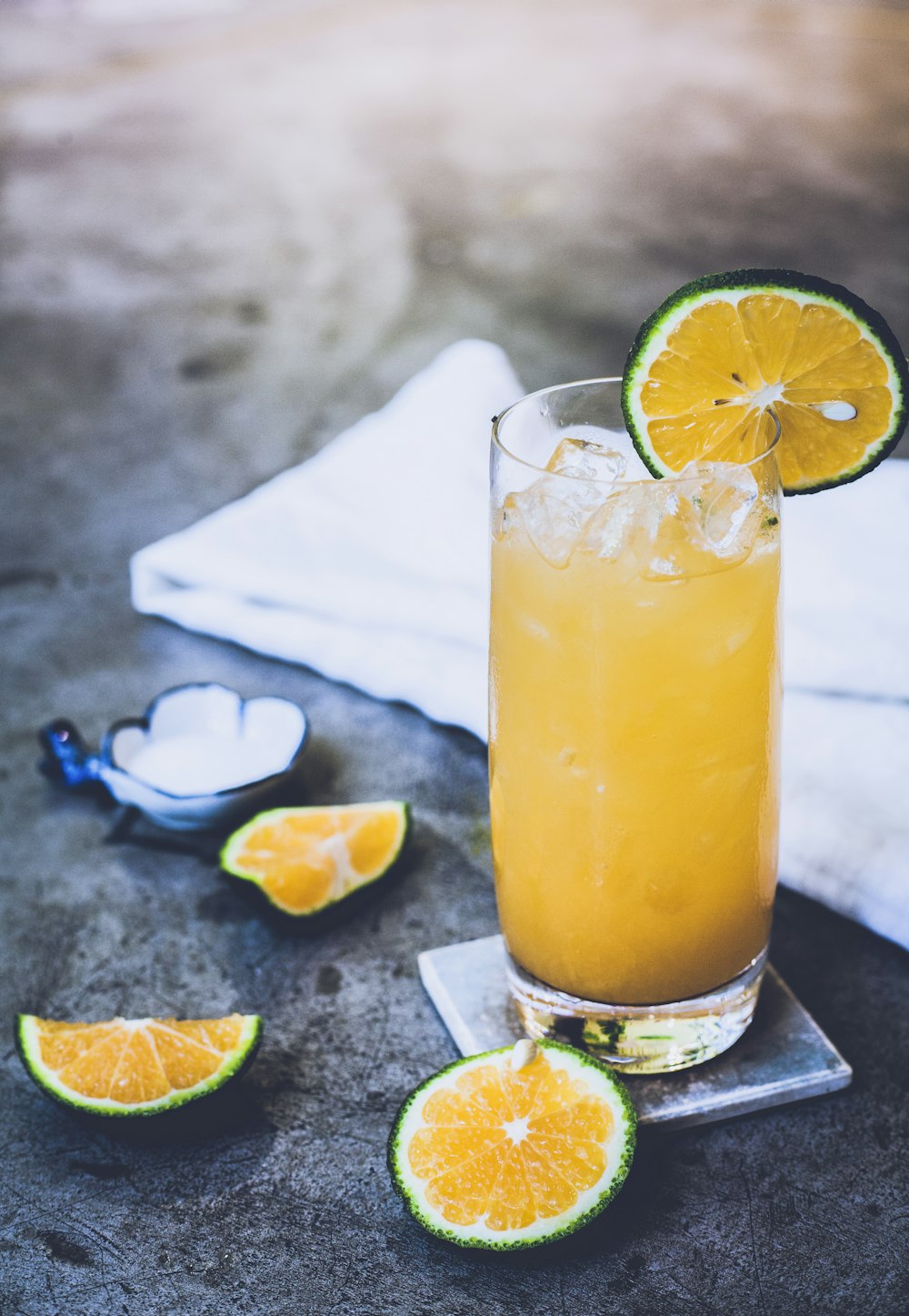 citrus juice on glass near towel