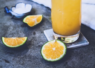 citrus juice on glass near towel