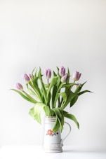 selective focus photography of purple tulip flower arrangement