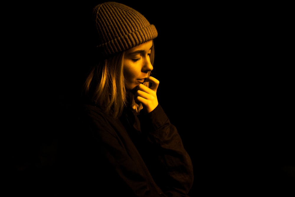 woman wearing gray knit cap on focus photo