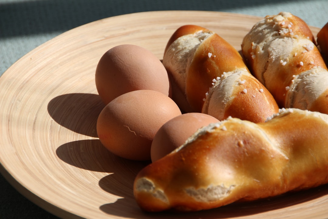 three organic eggs and three breads,