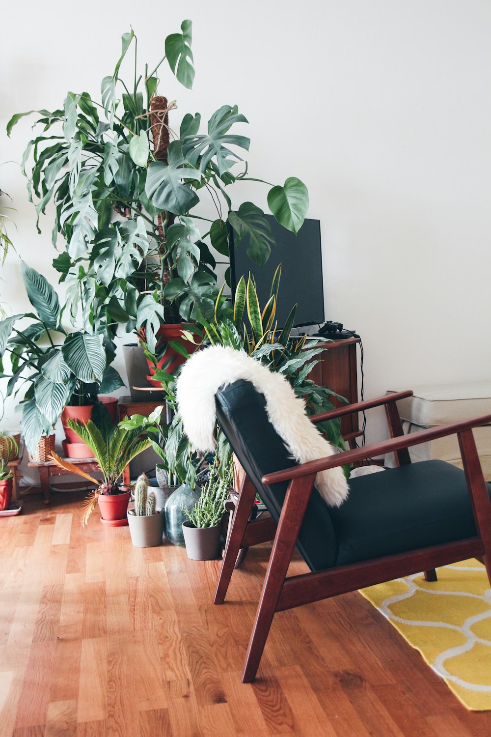 white fur textile on armchair