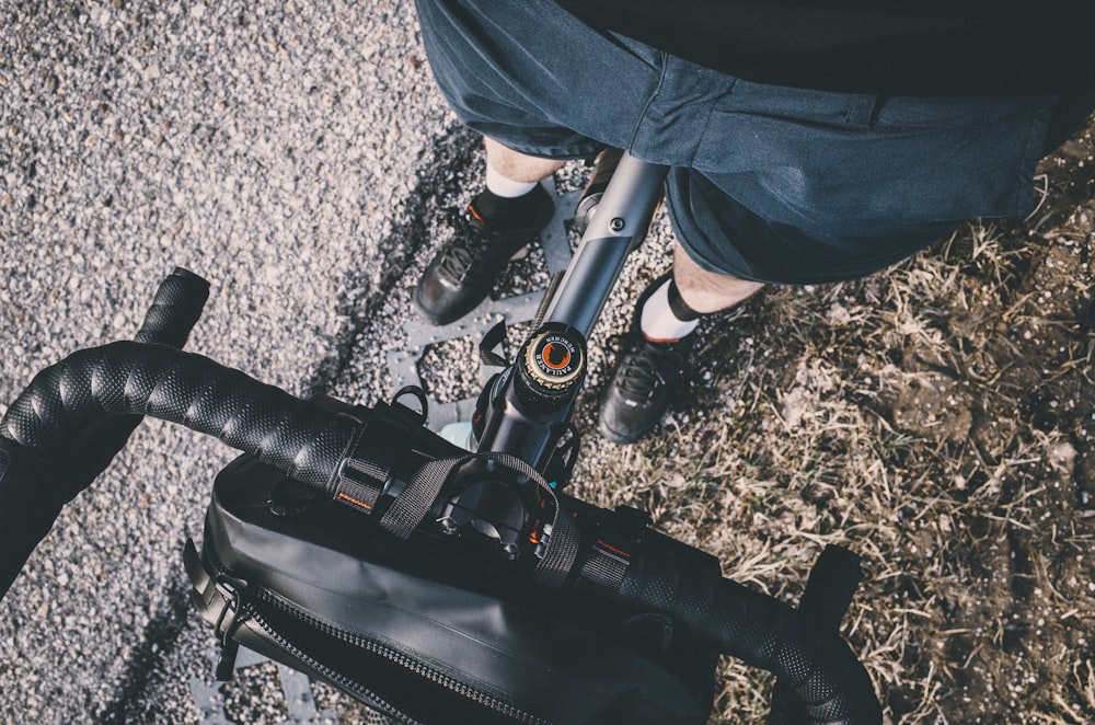 shallow focus photography of black bicycle handlebar