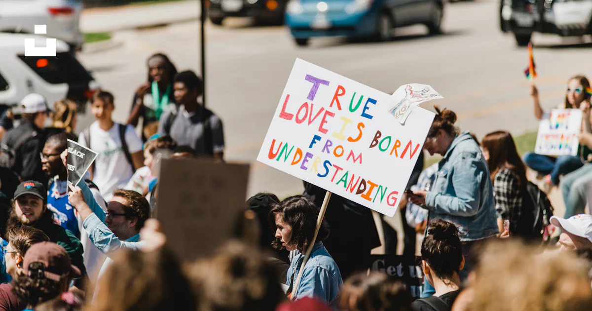 People holding signage rallying outdoor photo – Free People Image on ...