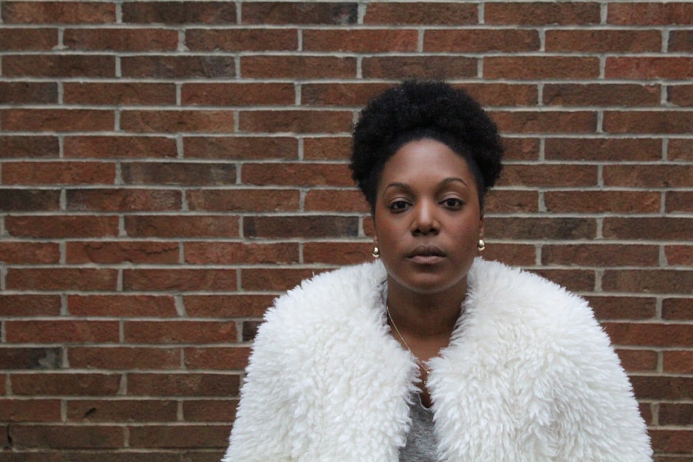 woman standing front of wall