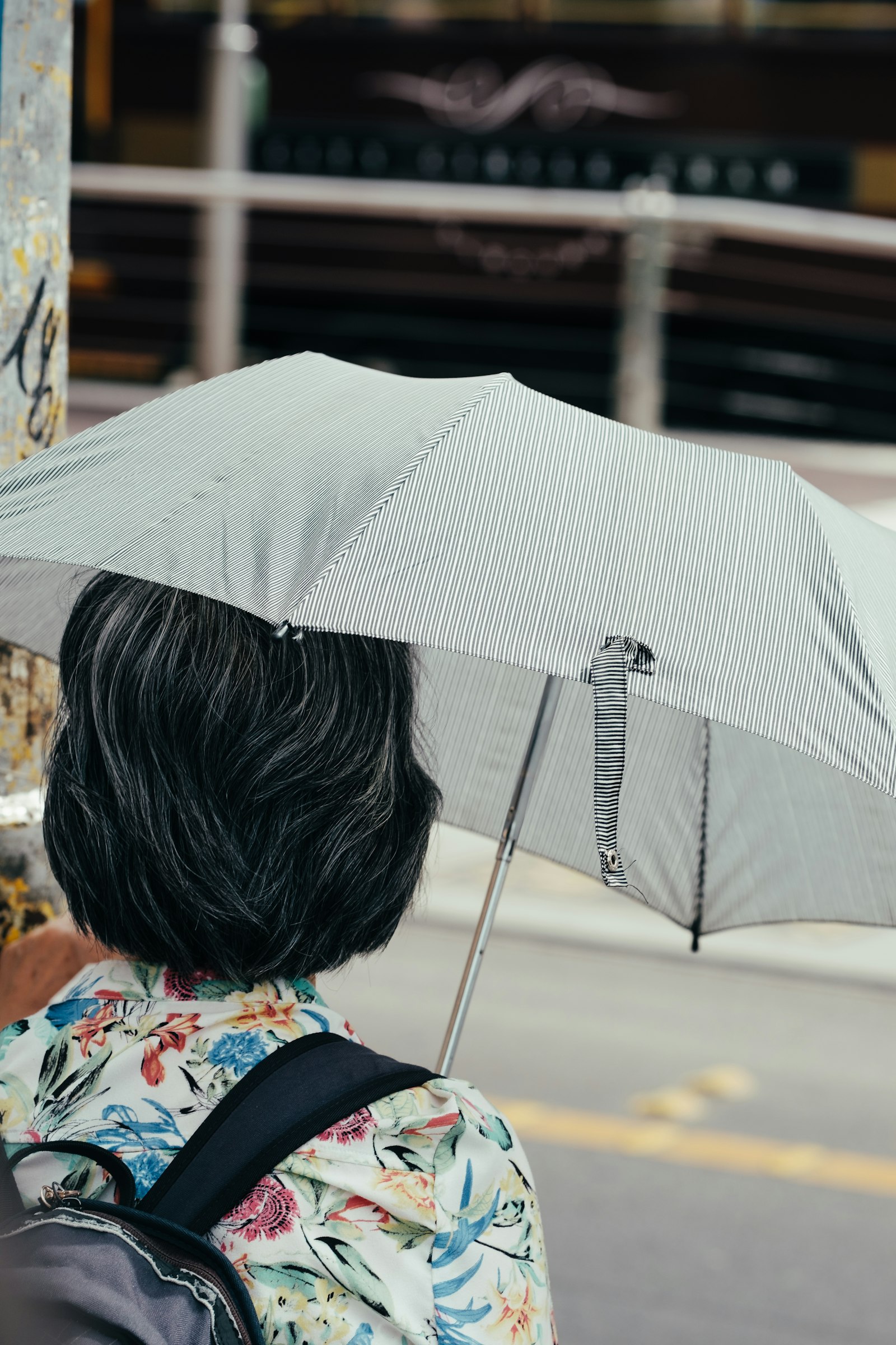 Fujifilm XF 90mm F2 R LM WR sample photo. Woman under grey umbrella photography