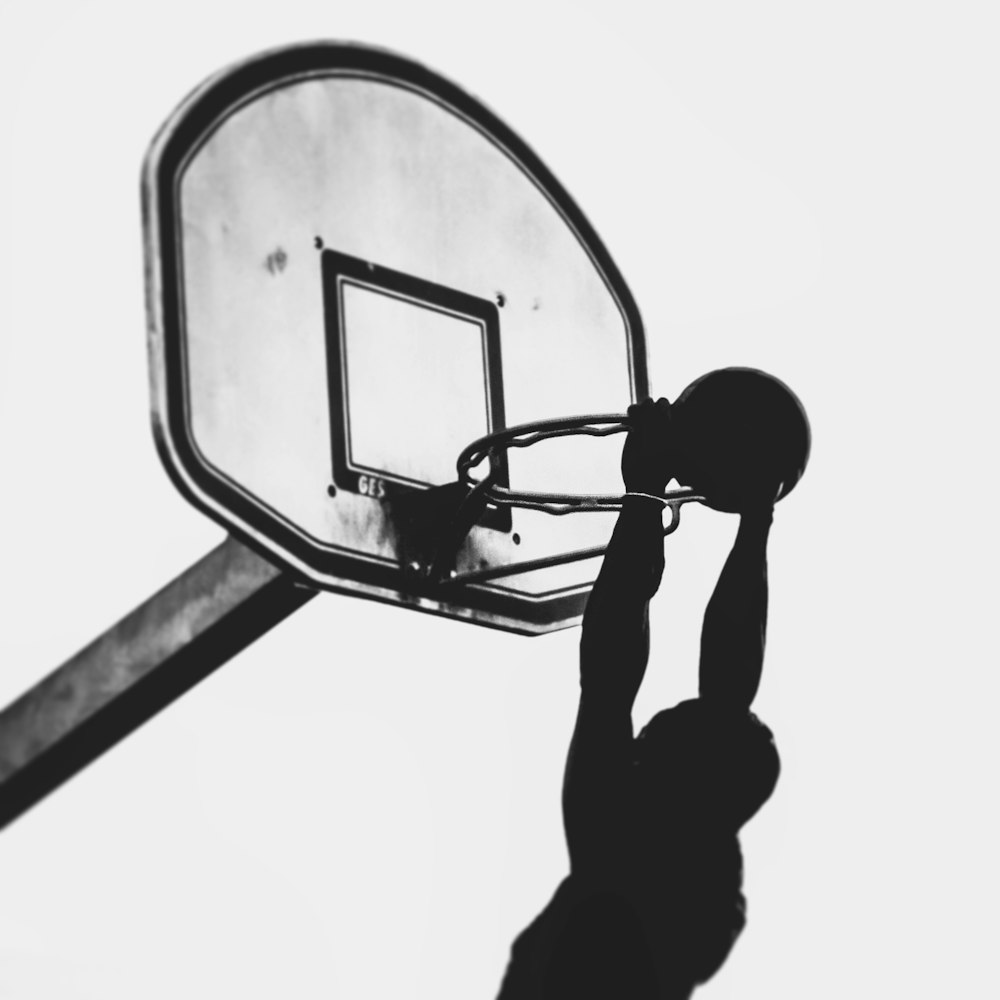 silhouette of man about to dunk