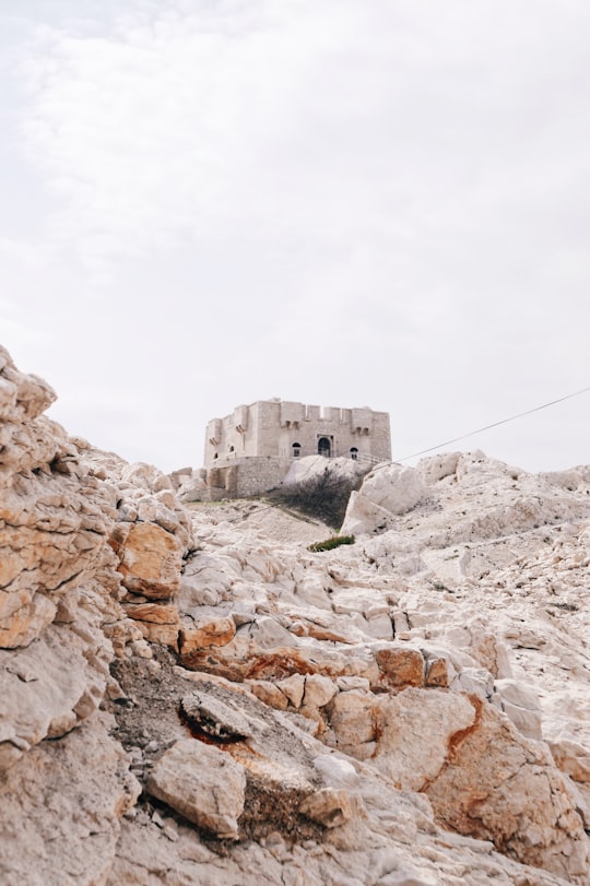 low angle photography of gray concrete building in Frioul archipelago France