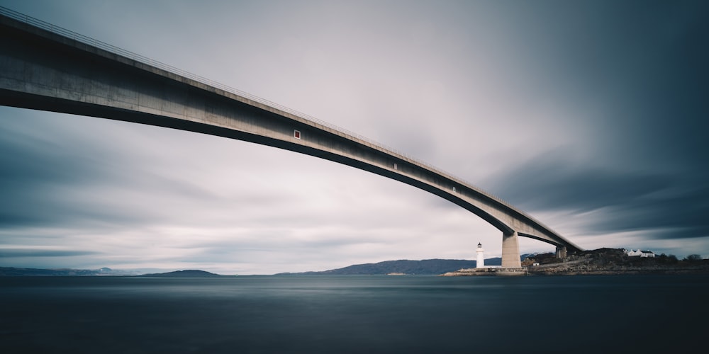 bridge above blue body of water panoramic photography