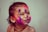 A joyful child coloring in a Madie's Magical World coloring book.