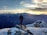 person standing on top of the mountain facing sunrise