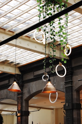 brass and white pendant lamps