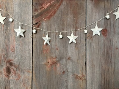 silver star buntings on wood pallet sleigh bells teams background