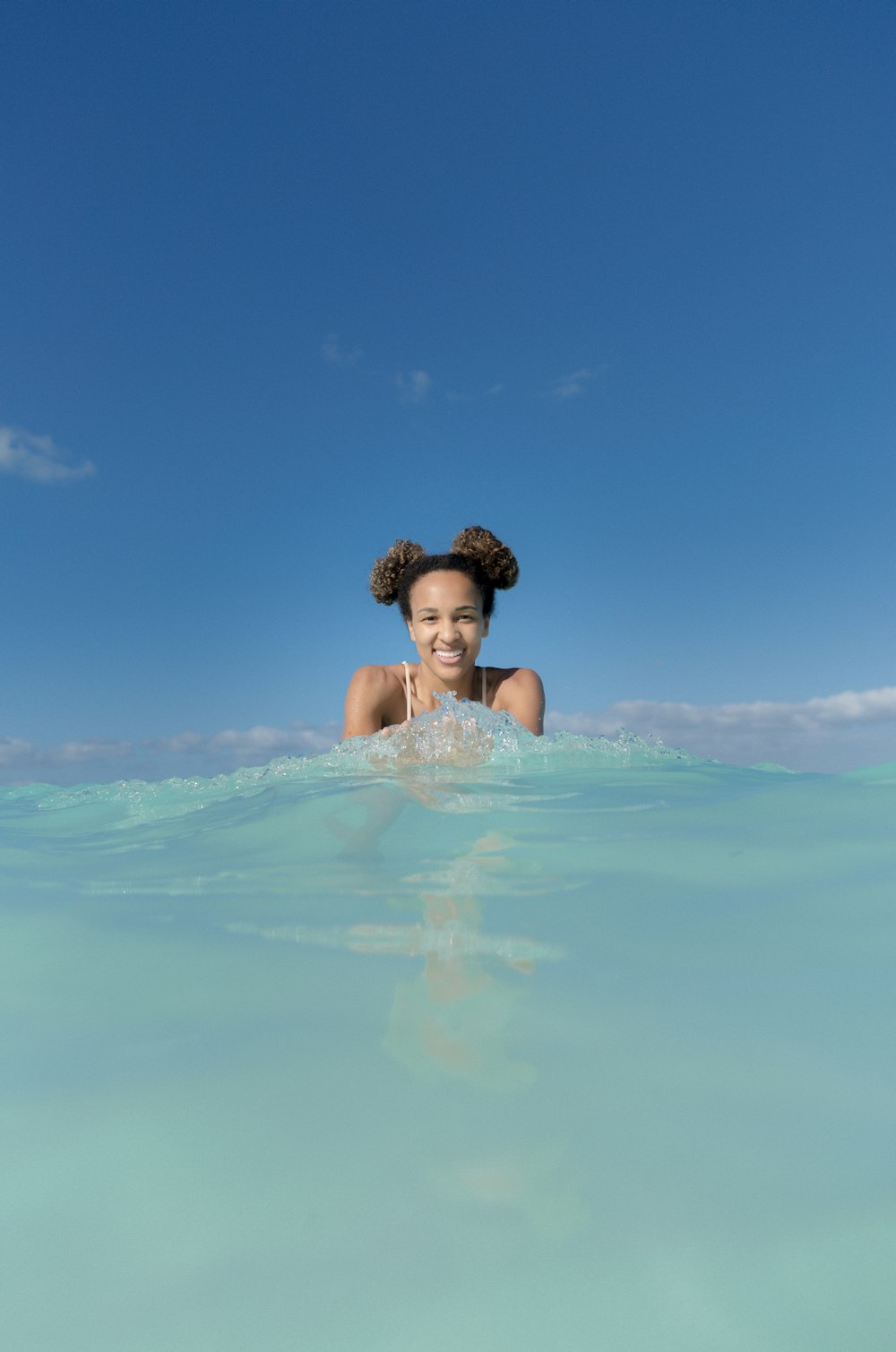 women smiling on water