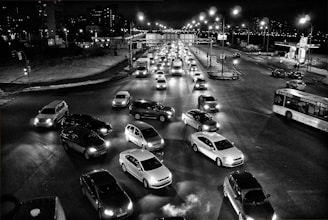 Surveillance cameras monitoring a busy city intersection at night.