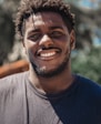 selective focus of man smiling during daytime